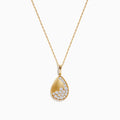 The 14K Yellow Gold Scattered Diamond Pendant features a teardrop-shaped diamond pendant partially encrusted with scattered diamonds, suspended from a delicate gold chain against a white background.
