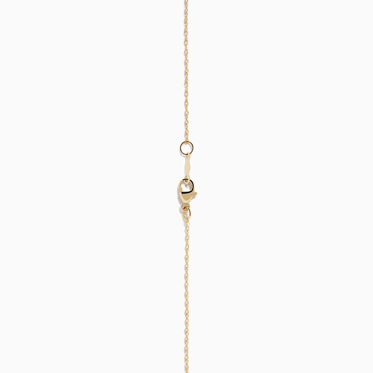 The 14K Yellow Gold Scattered Diamond Pendant features a teardrop-shaped diamond pendant partially encrusted with scattered diamonds, suspended from a delicate gold chain against a white background.