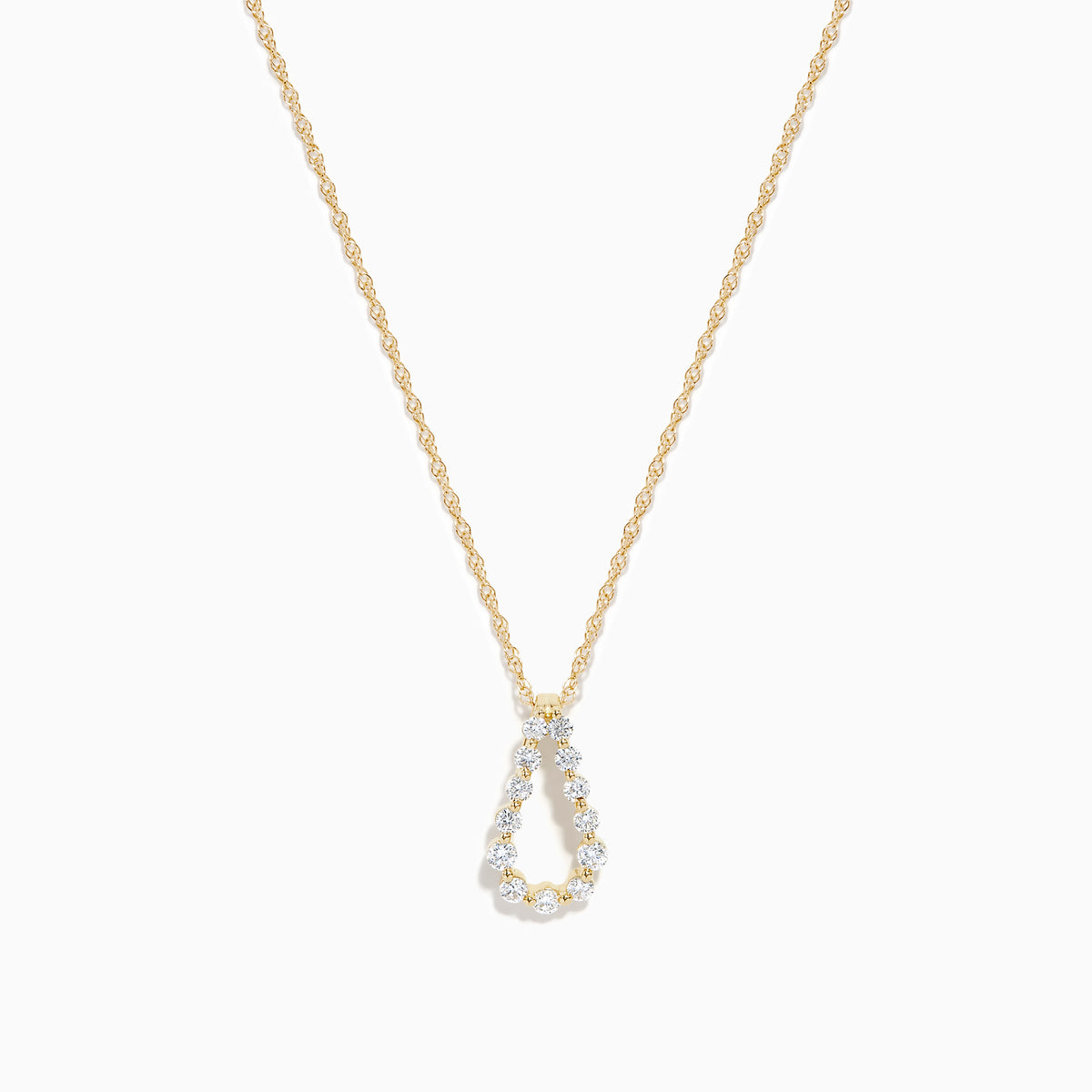 The DOro 14K Yellow Gold Diamond Pendant features a teardrop-shaped diamond accented with sparkling white stones, hanging on a delicate gold chain and set against a plain white background.
