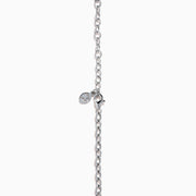 A close-up of the Ocean Bleu 14K White Gold Blue Topaz and Diamond Lavaliere Necklace featuring three oval blue topaz gemstones and diamonds in a vertical drop pendant, shown against a plain white background.