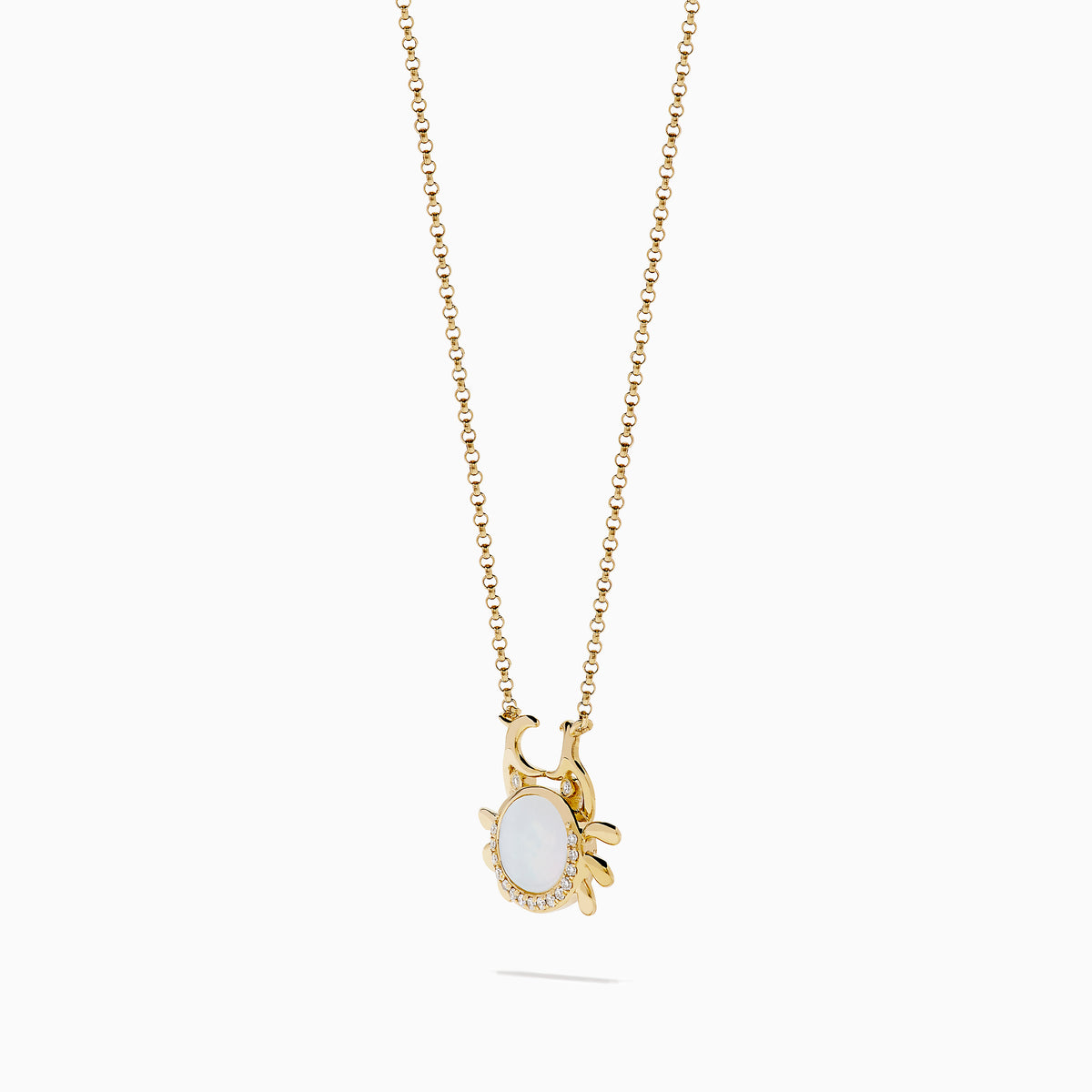 The Seaside 14K Yellow Gold Mother Of Pearl and Diamond Crab Necklace features a white oval mother of pearl center, shimmering diamond accents, and a charming crab pendant on a delicate yellow gold chain.