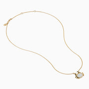 The Seaside 14K Yellow Gold Mother Of Pearl and Diamond Crab Necklace features a white oval mother of pearl center, shimmering diamond accents, and a charming crab pendant on a delicate yellow gold chain.