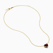 The 14K Yellow Gold Garnet and Diamond Halo Heart Pendant Necklace features a deep red garnet heart framed by a sparkling diamond halo on a yellow gold chain.