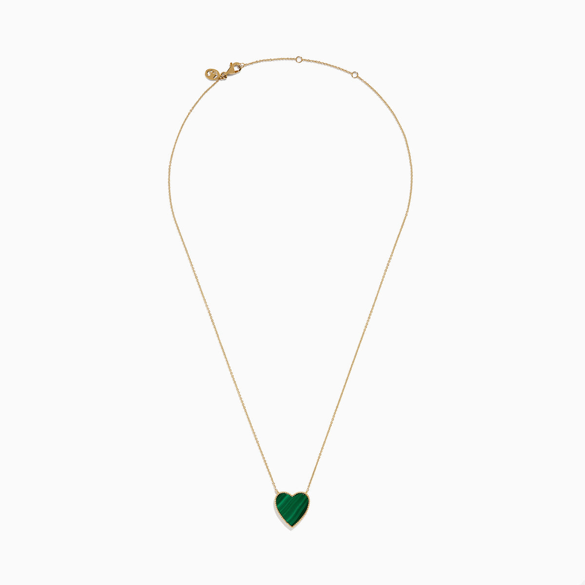 The 14K Gold Malachite and Diamond Reversible Heart Necklace showcases a large, heart-shaped malachite pendant with a smooth finish and delicate gold border.