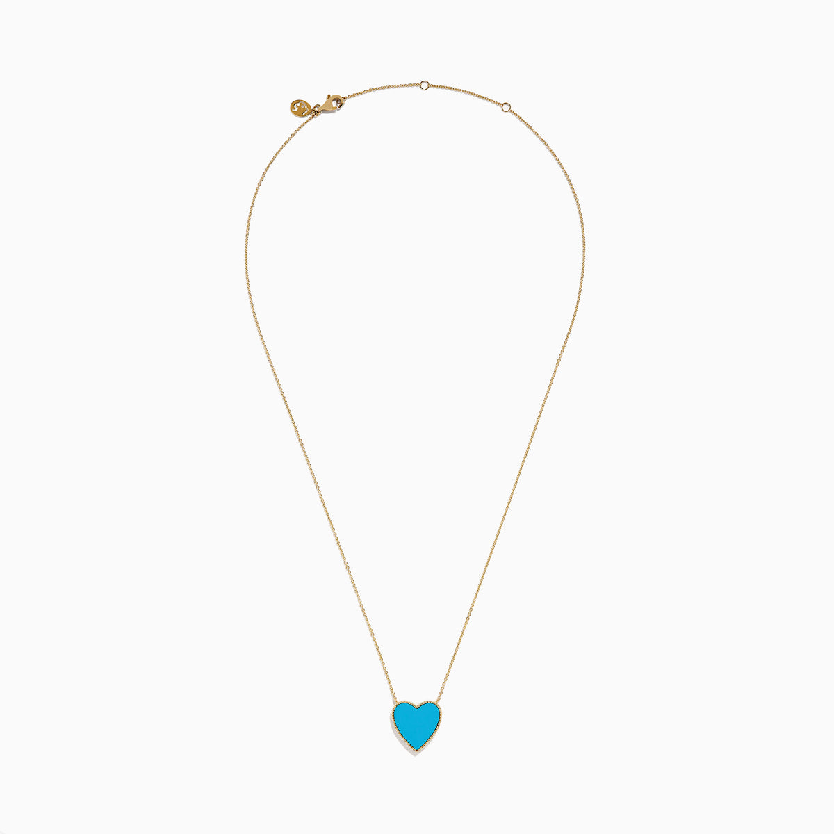 The 14K Gold Turquoise and Diamond Reversible Heart Necklace showcases a bold turquoise heart pendant framed in gold, displayed on a white background.