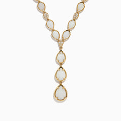 The Aurora 14K Yellow Gold Opal and Diamond Y Necklace showcases three pear-shaped opals in a vertical drop pendant, with small diamonds accenting some of the links between the opals.