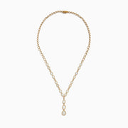 The Aurora 14K Yellow Gold Opal and Diamond Y Necklace showcases three pear-shaped opals in a vertical drop pendant, with small diamonds accenting some of the links between the opals.
