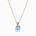 The Aquarius Pendant features a cushion-cut aquamarine set in 14K rose and white gold with diamonds, displayed on a delicate chain against a white background.