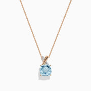The Aquarius Pendant features a cushion-cut aquamarine set in 14K rose and white gold with diamonds, displayed on a delicate chain against a white background.