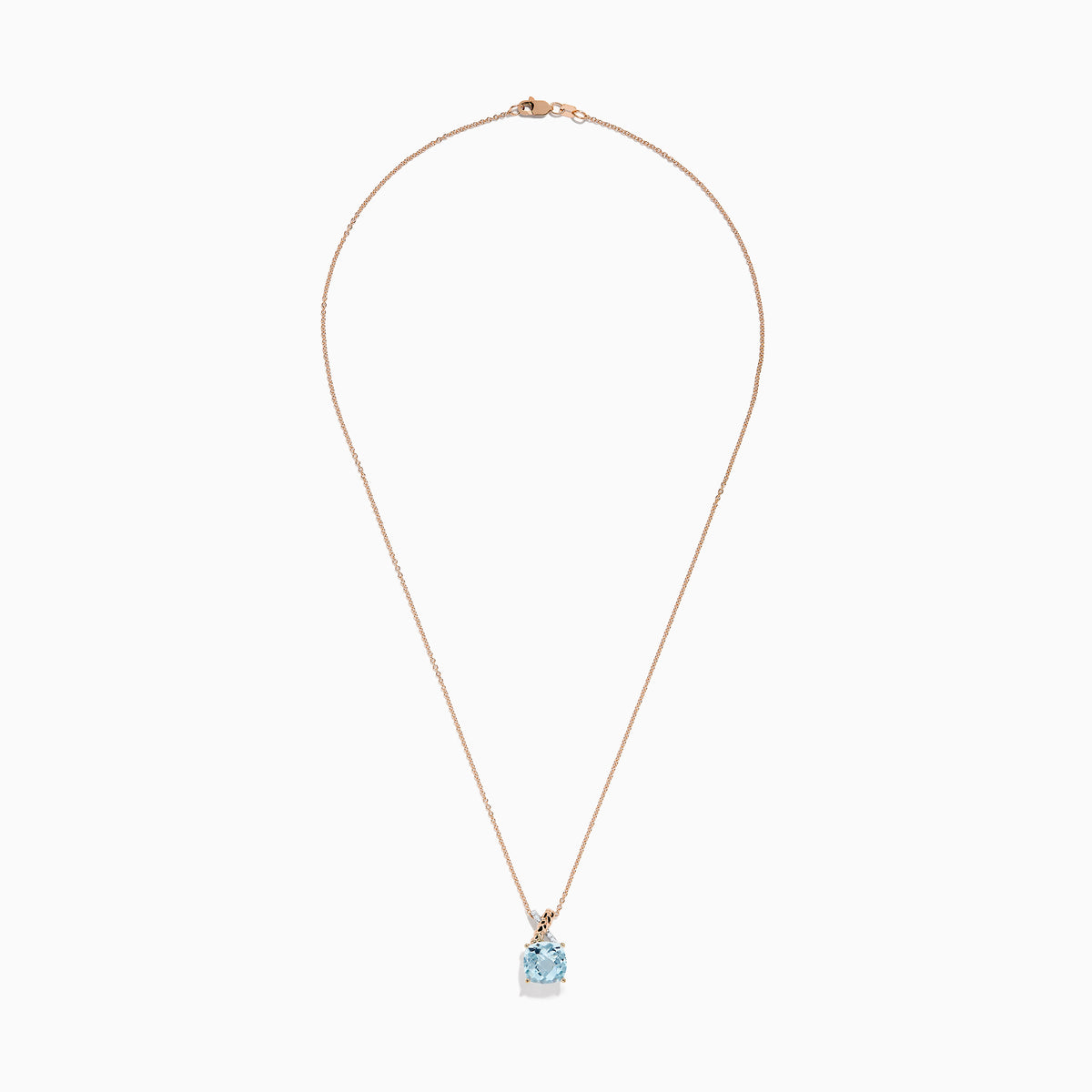 The Aquarius Pendant features a cushion-cut aquamarine set in 14K rose and white gold with diamonds, displayed on a delicate chain against a white background.