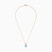 The Aquarius Pendant features a cushion-cut aquamarine set in 14K rose and white gold with diamonds, displayed on a delicate chain against a white background.