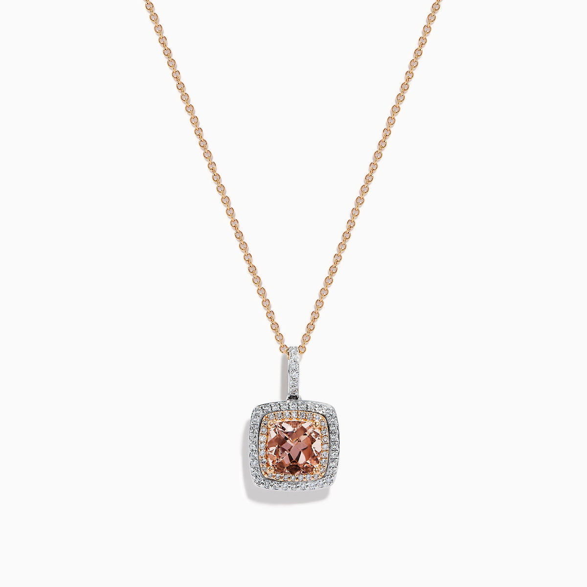 The 14K Two Tone Gold Morganite and Diamond Pendant features a cushion-cut peach morganite surrounded by sparkling diamonds, set in a blend of rose and white gold for an elegant, refined look.