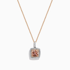 The 14K Two Tone Gold Morganite and Diamond Pendant features a cushion-cut peach morganite surrounded by sparkling diamonds, set in a blend of rose and white gold for an elegant, refined look.