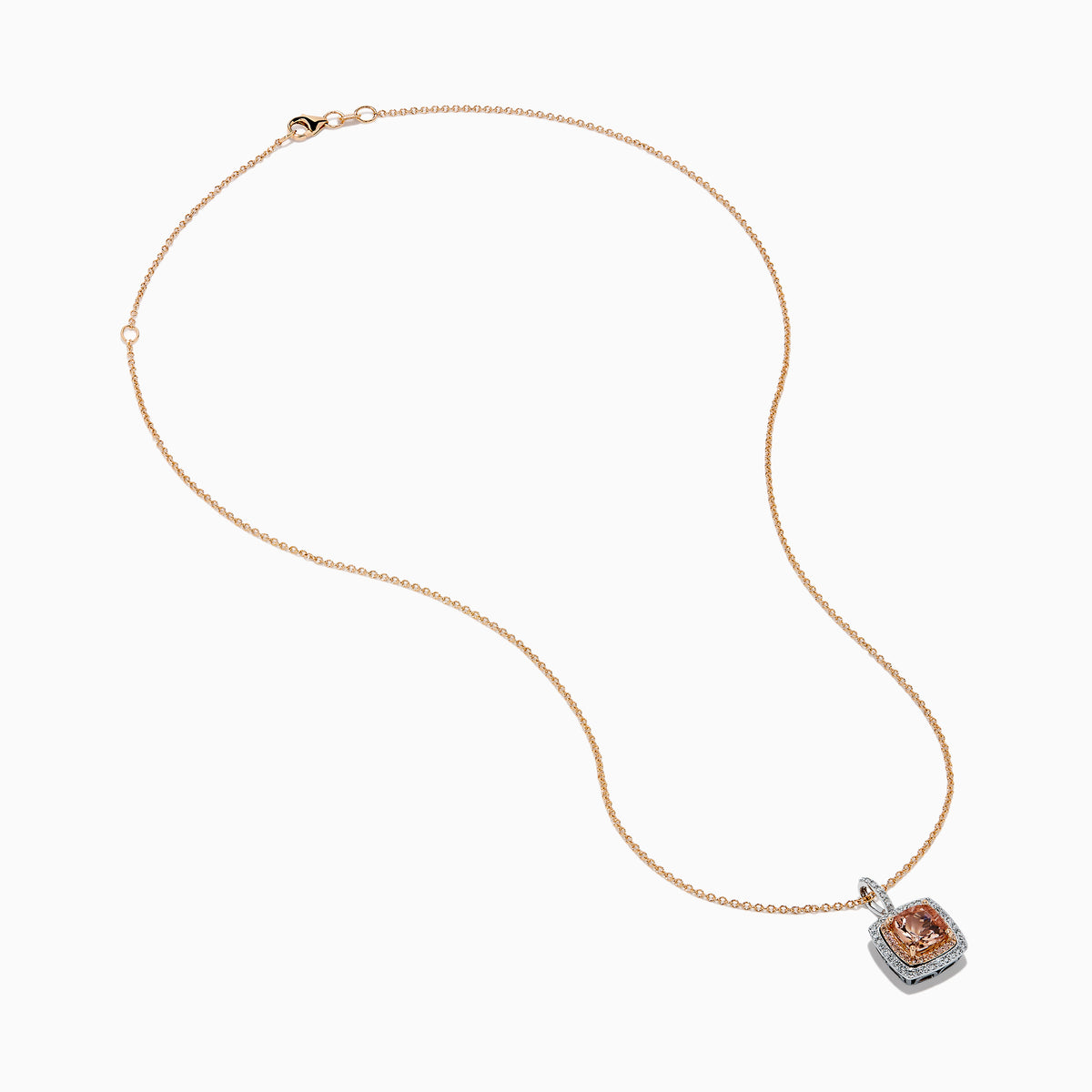 The 14K Two Tone Gold Morganite and Diamond Pendant features a cushion-cut peach morganite surrounded by sparkling diamonds, set in a blend of rose and white gold for an elegant, refined look.