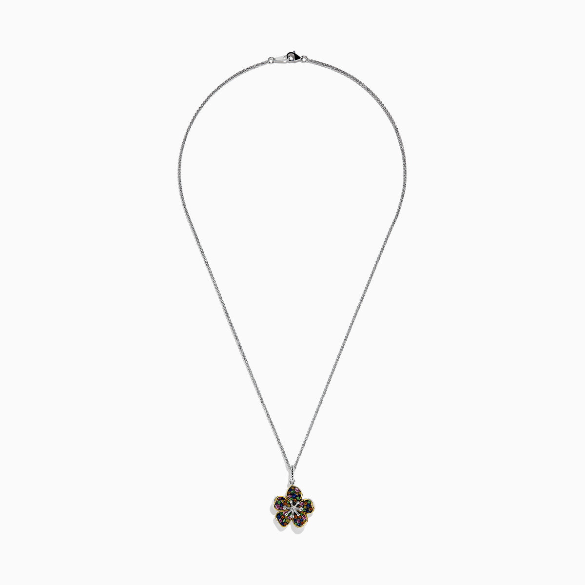 The Splash Sterling Silver Diamond, Sapphires & Tsavorite Flower Necklace features a silver chain with a flower pendant edged in gold, adorned with vibrant sapphires and tsavorite on each petal, and a sparkling diamond at the center.