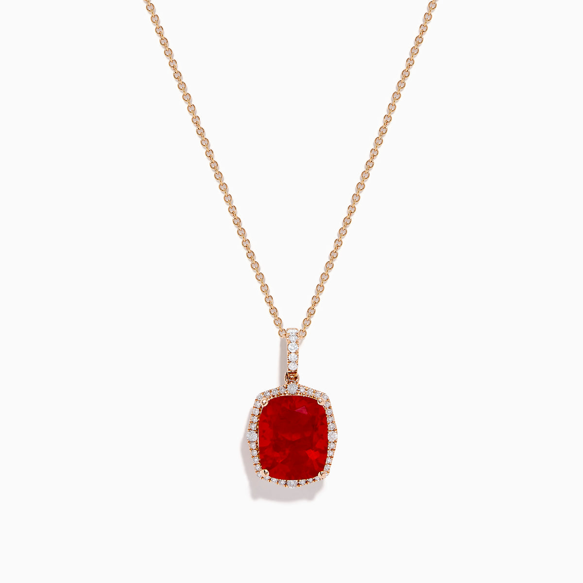 An elegant gold chain necklace with a cushion-cut red gemstone pendant and white diamonds—perfectly complements the Aurora 14K Rose Gold Fire Opal and Diamond Ring.