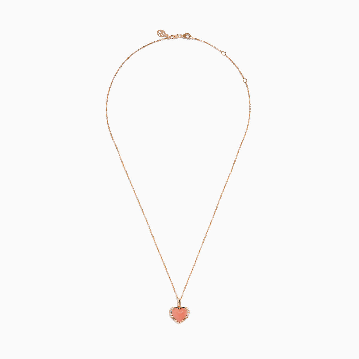 The 14K Rose Gold Pink Opal and Diamond Heart Pendant features a pink opal heart accented with sparkling diamonds on a rose gold chain.