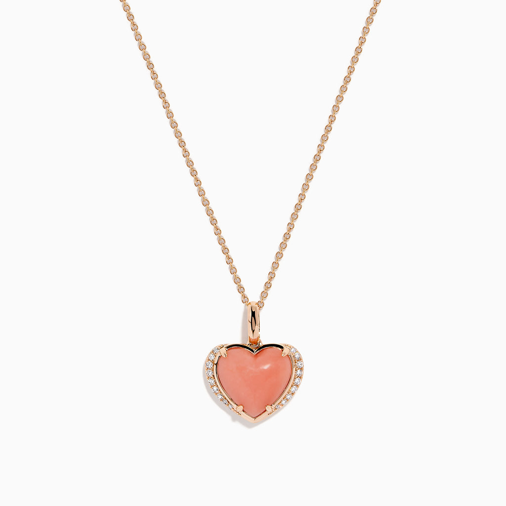 The 14K Rose Gold Pink Opal and Diamond Heart Pendant features a pink opal heart accented with sparkling diamonds on a rose gold chain.
