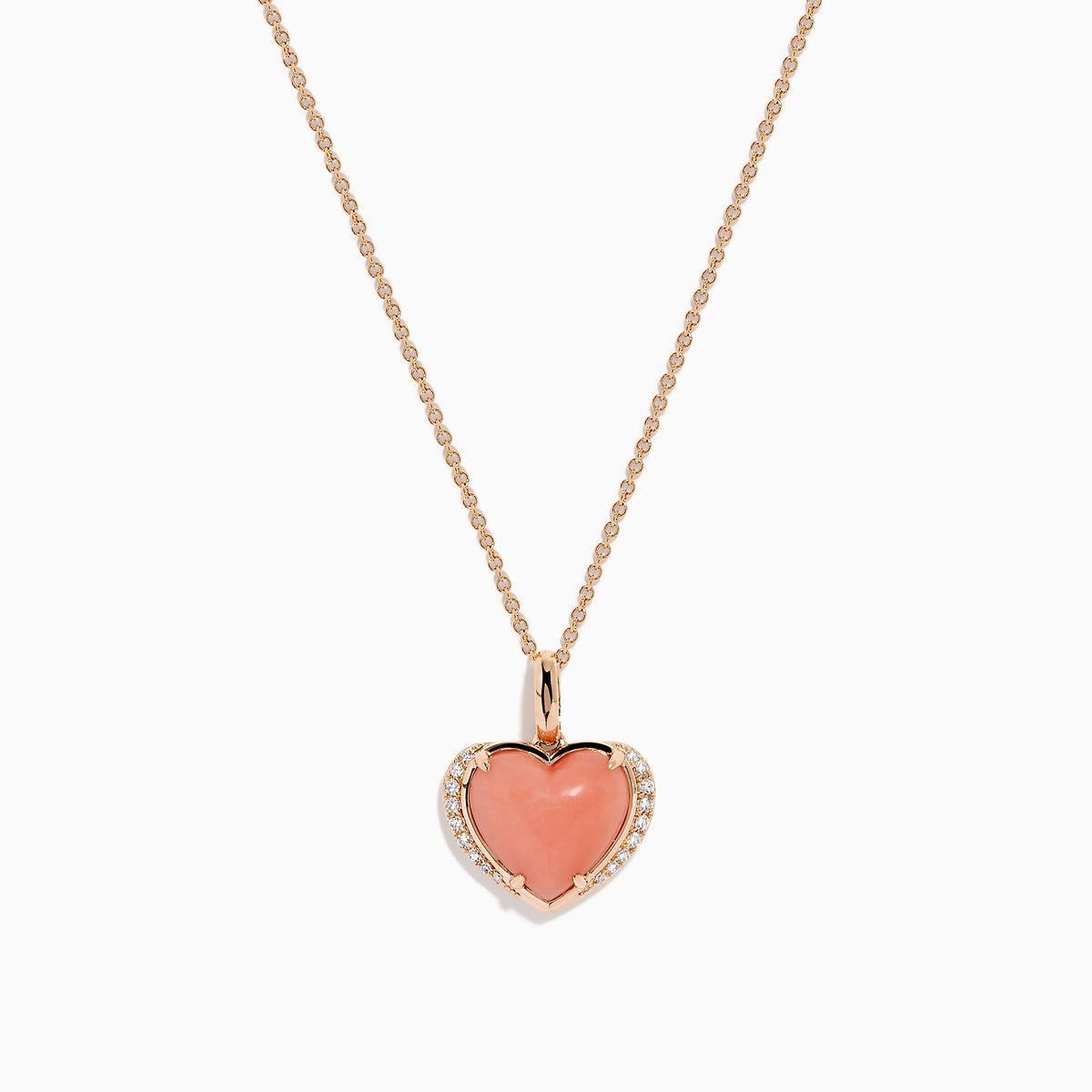 The 14K Rose Gold Pink Opal and Diamond Heart Pendant features a pink opal heart accented with sparkling diamonds on a rose gold chain.
