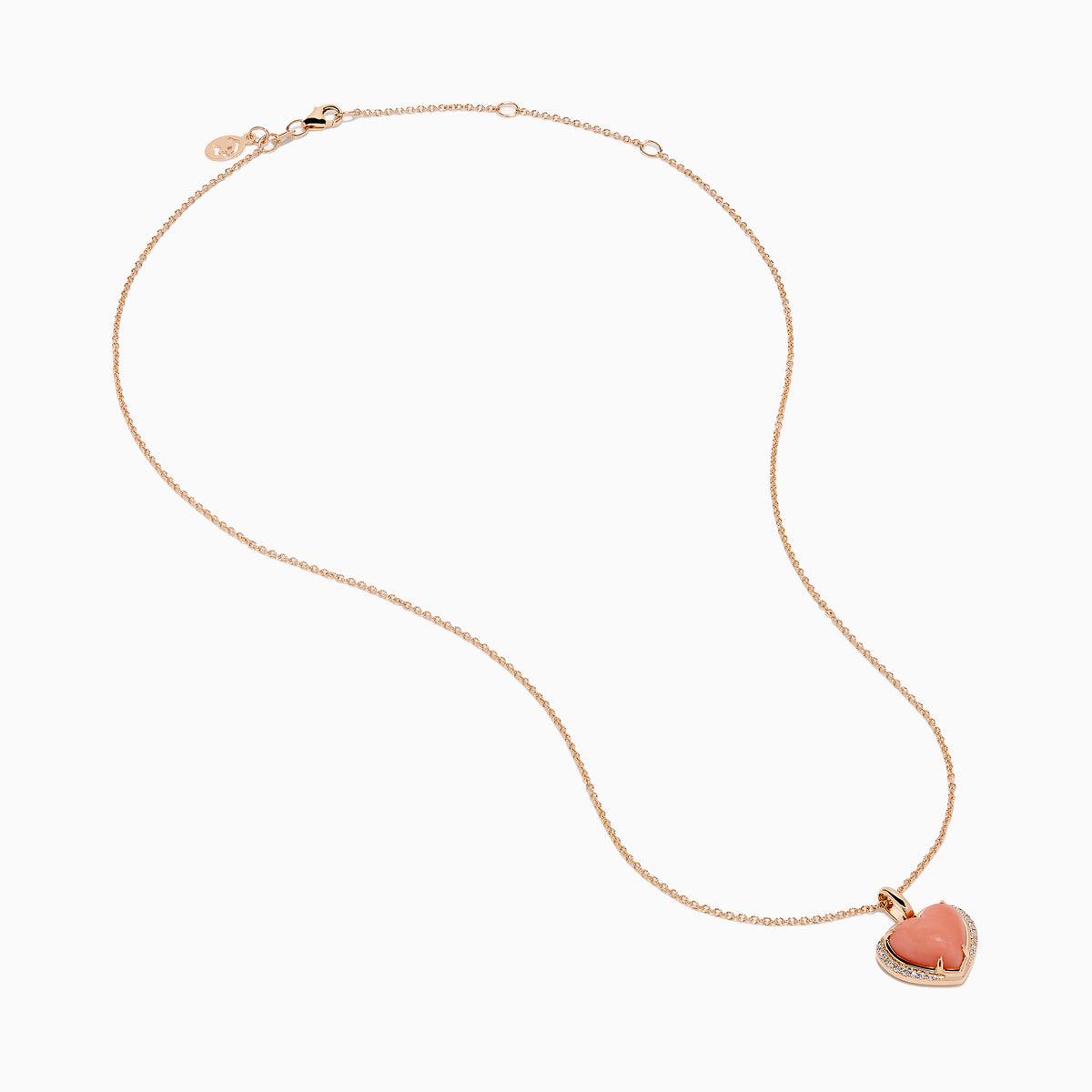The 14K Rose Gold Pink Opal and Diamond Heart Pendant features a pink opal heart accented with sparkling diamonds on a rose gold chain.