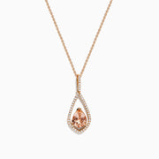 The Blush 14K Rose Gold Morganite and Diamond Pendant features a pear-shaped morganite framed by a halo of white diamonds on a delicate rose gold chain.