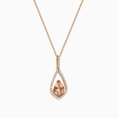 The Blush 14K Rose Gold Morganite and Diamond Pendant features a pear-shaped morganite framed by a halo of white diamonds on a delicate rose gold chain.