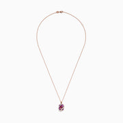 The 14K Rose Gold Pink Amethyst and Diamond Pendant features a large faceted pink amethyst wrapped in a wavy band of diamonds, suspended from a delicate rose gold chain against a white background.