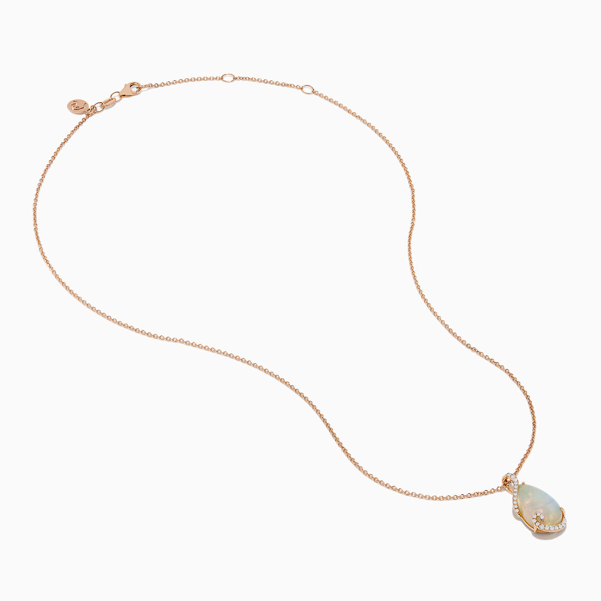 The Aurora 14K Rose Gold Opal and Diamond Pendant features a teardrop-shaped opal accented by a delicate swirl of sparkling diamonds, hanging from a fine gold chain against a plain white background.