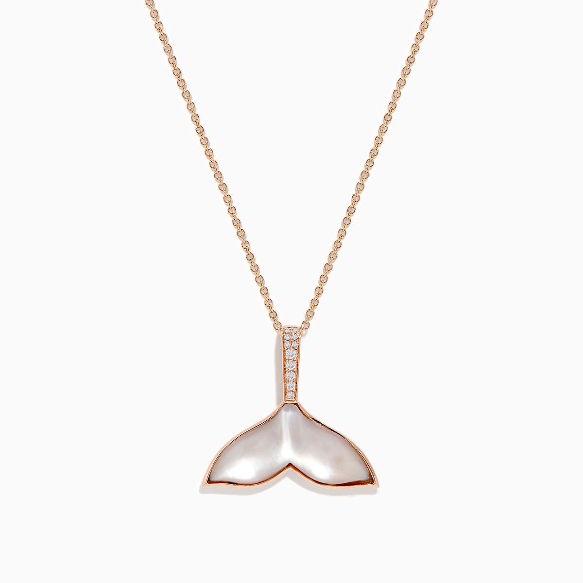 The Seaside 14K Gold Pendant features a whale’s tail design with mother-of-pearl inlay, sparkling diamonds on the bail, and a touch of quartz crystal for added elegance.