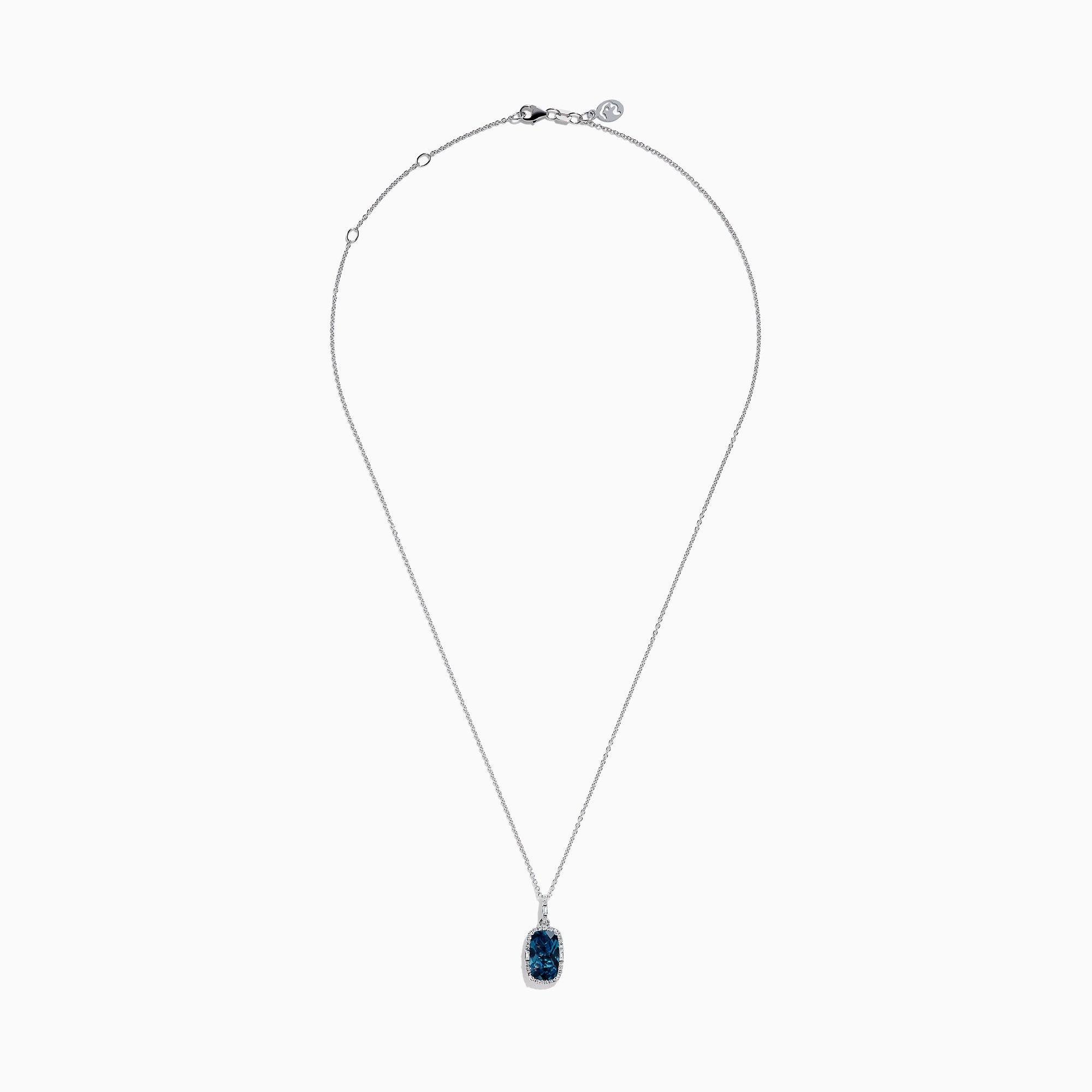 A 14 karat white gold necklace featuring an elongated cushion blue topaz and diamond pendant, set in an elegant frame.