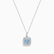 The Aquarius 14K White Gold Aquamarine and Diamond Pendant features a slim white gold chain with a square aquamarine center stone, accented by sparkling diamonds, all displayed against a white background.