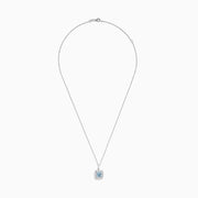 The Aquarius 14K White Gold Aquamarine and Diamond Pendant features a slim white gold chain with a square aquamarine center stone, accented by sparkling diamonds, all displayed against a white background.