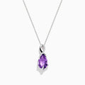 The 14K White Gold Amethyst and Diamond Pendant features a teardrop-shaped amethyst accented with sparkling diamonds, all elegantly set in a twisting white gold design.