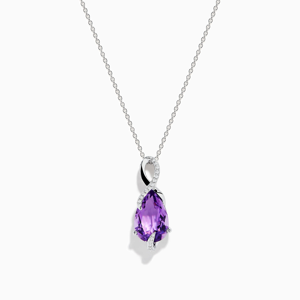 The 14K White Gold Amethyst and Diamond Pendant features a teardrop-shaped amethyst accented with sparkling diamonds, all elegantly set in a twisting white gold design.