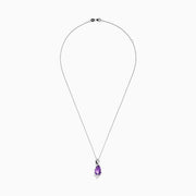 The 14K White Gold Amethyst and Diamond Pendant features a teardrop-shaped amethyst accented with sparkling diamonds, all elegantly set in a twisting white gold design.