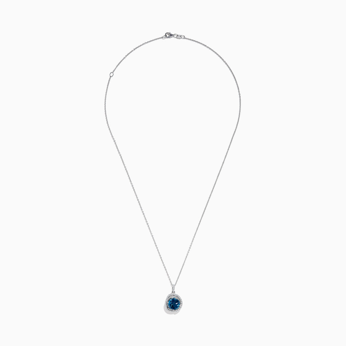 The Ocea Bleu 14K White Gold Blue Topaz and Diamond Pendant showcases a round blue topaz encircled by small diamonds, hanging from a delicate chain against a white background.