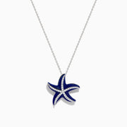 The Seaside 14K White Gold Lapis and Diamond Starfish Pendant features deep blue lapis enamel and sparkling diamonds, elegantly displayed against a plain white background.