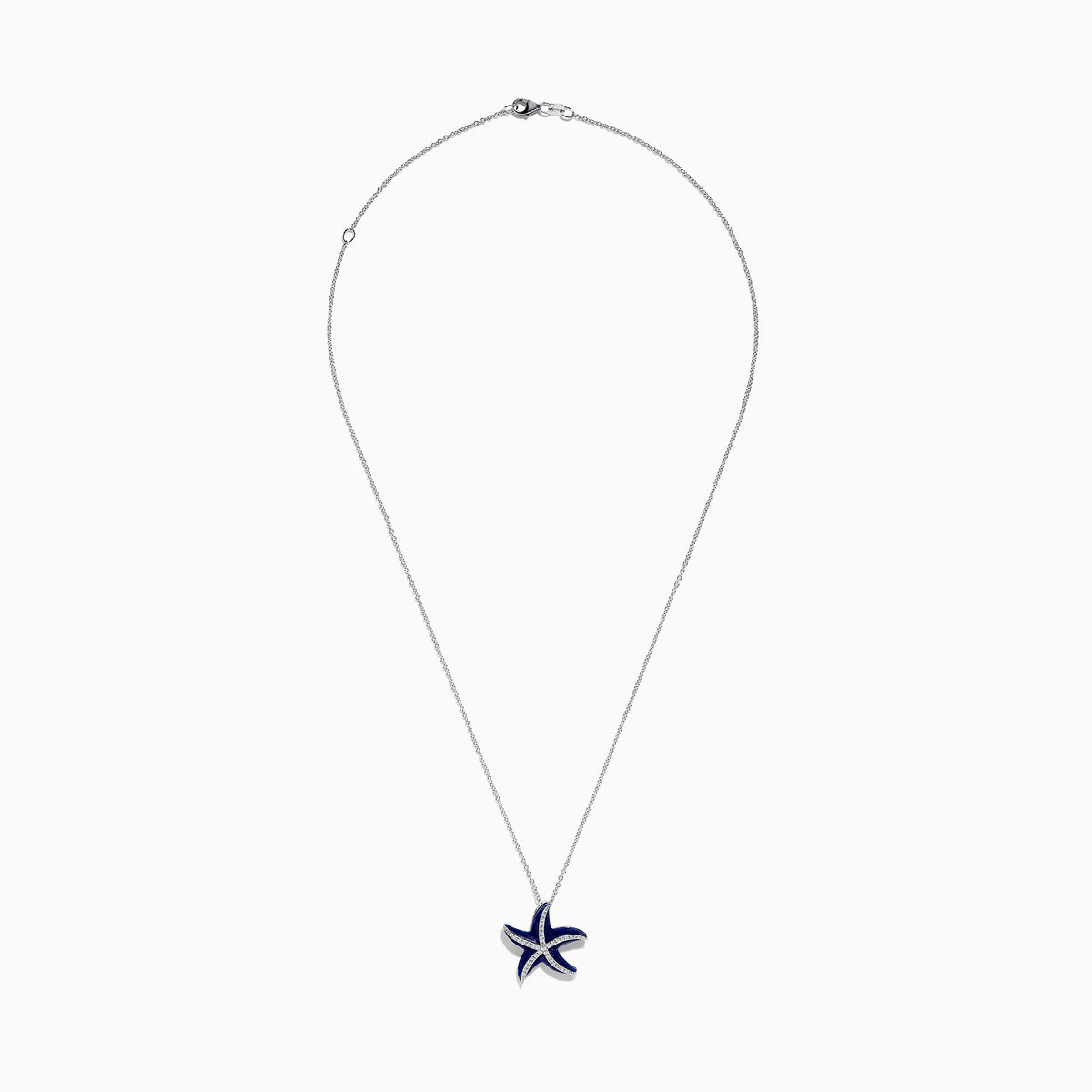 The Seaside 14K White Gold Lapis and Diamond Starfish Pendant features deep blue lapis enamel and sparkling diamonds, elegantly displayed against a plain white background.