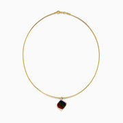 A 14K yellow gold snake chain pendant necklace featuring an ammolite and diamond, its multicolored gemstone showcased against a plain white background.