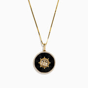 The Novelty 14K Yellow Gold Onyx and Diamond Compass Disc Pendant features a round onyx-black center, star-shaped design with a central diamond, and a border of small white stones on a gold chain. Plain white background.