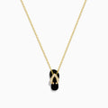 A delicate 14K yellow gold necklace features a flip flop pendant accented with onyx and diamonds, displayed against a white background.