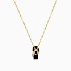 A delicate 14K yellow gold necklace features a flip flop pendant accented with onyx and diamonds, displayed against a white background.
