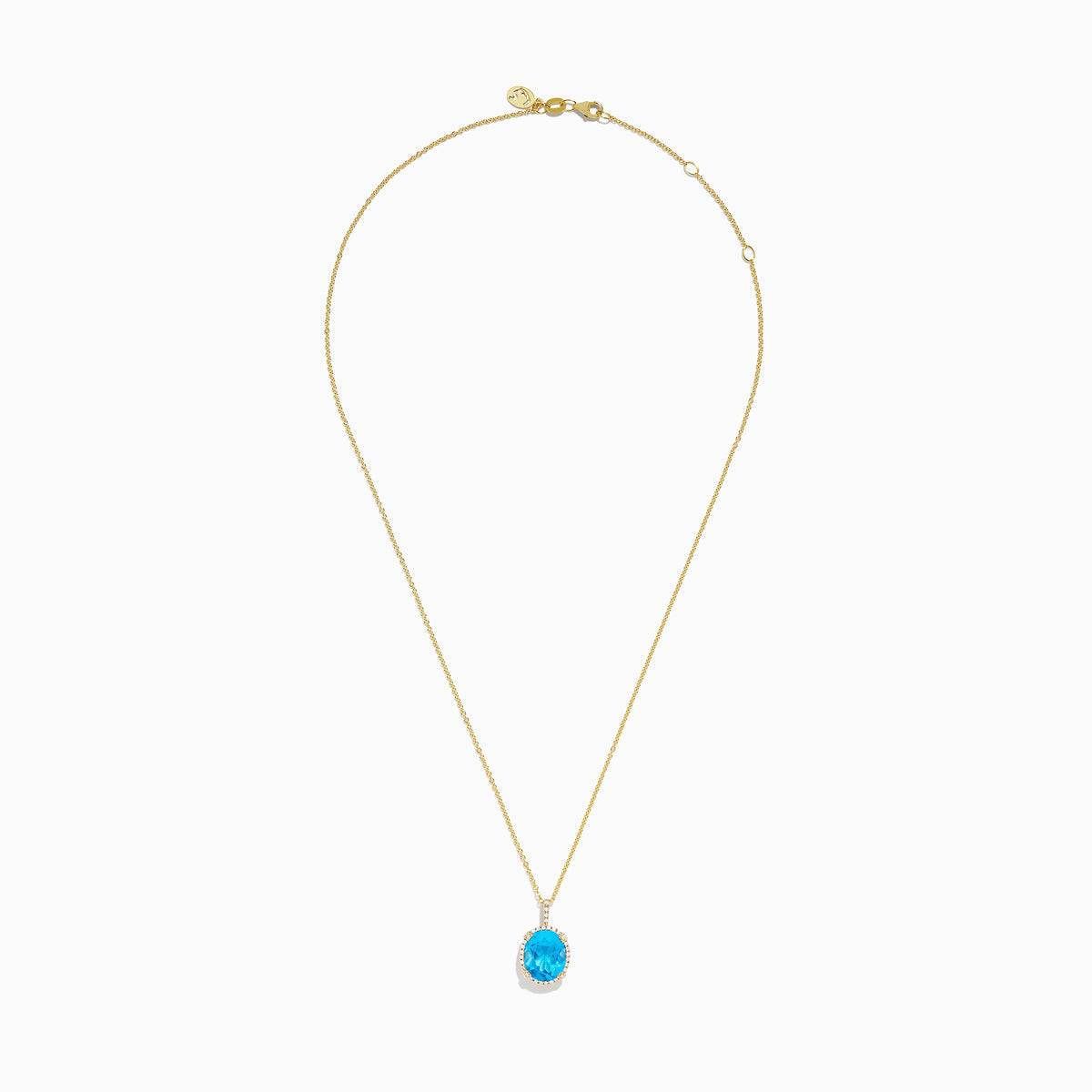 The Ocean Bleu 14K Yellow Gold Blue Topaz and Diamond Pendant features an oval blue topaz surrounded by sparkling diamonds on a gold chain, displayed against a white background.
