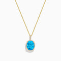 The Ocean Bleu 14K Yellow Gold Blue Topaz and Diamond Pendant features an oval blue topaz surrounded by sparkling diamonds on a gold chain, displayed against a white background.