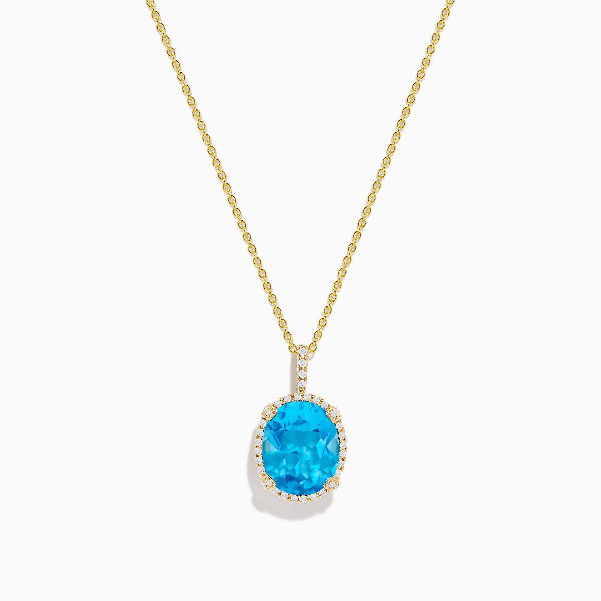 The Ocean Bleu 14K Yellow Gold Blue Topaz and Diamond Pendant features an oval blue topaz surrounded by sparkling diamonds on a gold chain, displayed against a white background.