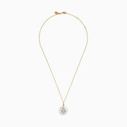 The 14K Yellow Gold Fresh Water Pearl and Diamond Anchor Pendant features a round pearl and anchor design adorned with diamonds.