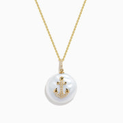 The 14K Yellow Gold Fresh Water Pearl and Diamond Anchor Pendant features a round pearl and anchor design adorned with diamonds.