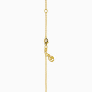 The Safari 14K Yellow Gold Tiger Eye Giraffe Pendant showcases a charming giraffe with brown and white enamel details and a green head accent, set against a plain white background.