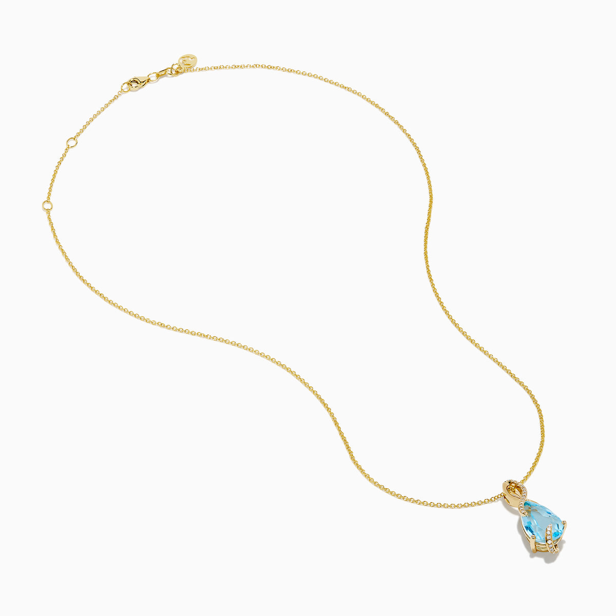The Ocean Bleu 14K Yellow Gold Blue Topaz and Diamond Pear Pendant features a pear-shaped Blue Topaz accented with diamond swirls, set in 14K yellow gold and photographed on a plain white background.