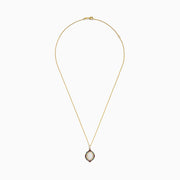 The Aurora 14K Yellow Gold Pendant features an ornate oval opal center, accented by diamonds and multi color sapphires in a decorative pattern on a gold chain necklace.